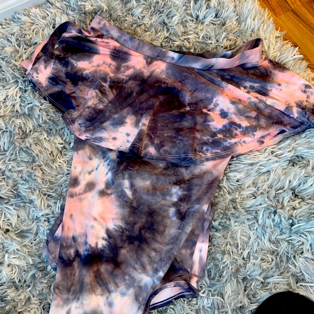 Over the shoulder onesie. Multi colored. 2 clips.